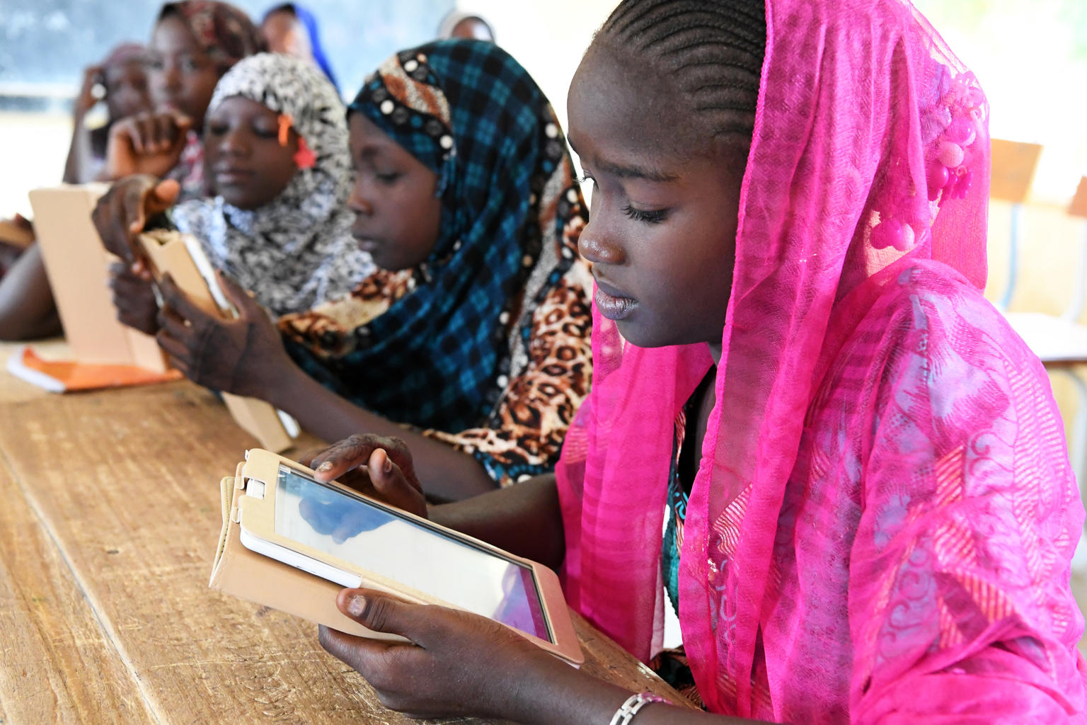 Students with tablets in a school in Niamey, the capital of Niger.

The school received from UNICEF child-friendly tablets, with off-line educational content, such as French-language, Wikipedia and Khan Academy, which are adapted to the local context and curriculum. The equipment un on solar power, and a local company partnering will ensure the maintenance and technical training. 

For every child, education.