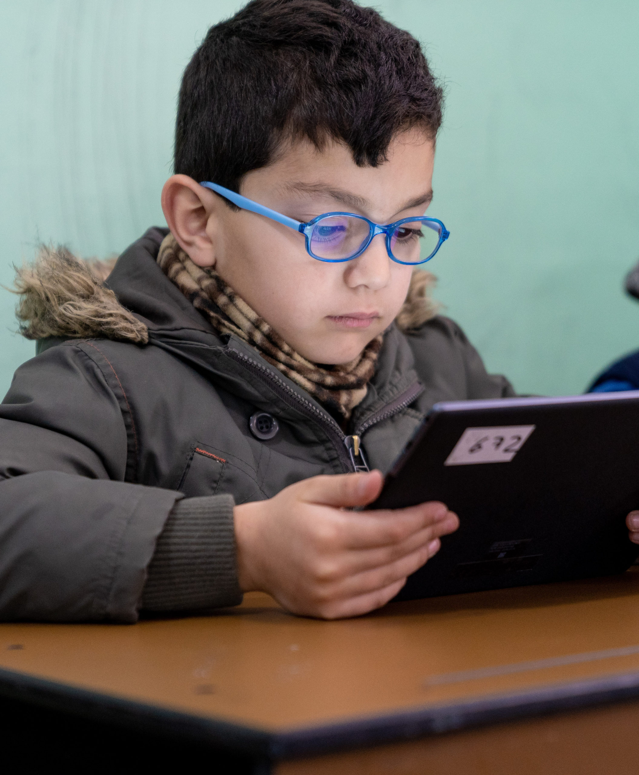 "I like to use the tablet. It has pictures, animations, songs and other things. It is useful for our studies," said Rayyan, 7 years in his school.

A new multimedia learning programme is promoting literacy and social cohesion in Jordan.

The multimedia enrichment educational materials support children's learning through extracurricular classes with the aim of promoting life skills and social cohesion. More than 100 stories are helping children from Kindergarten to 3rd Grade develop their critical thinking and communication skills, while also promoting respect, participation and equity among students.

These materials have been developed and produced in line with the national curriculum and teachers have been provided with teaching aids that encourage innovation, critical thinking, communication skills and promote social values among students. 

Additionally, teachers trained on the use of these materials through the integration of ICT, which will target around 50,000 Jordanian and Syrian students.

The programme, first implemented in 10 pilot schools, is being scaled up with UNICEF support and rolled out to 100 schools throughout the country in partnership with the Ministry of Education. This includes double-shifted schools in the host community, created to support Syrian refugee students.

The multimedia programme is generously supported by UK aid.

A new multimedia learning programme is promoting literacy and social cohesion in Jordan.

The multimedia enrichment educational materials support children's learning through extracurricular classes with the aim of promoting life skills and social cohesion. More than 100 stories are helping children from Kindergarten to 3rd Grade develop their critical thinking and communication skills, while also promoting respect, participation and equity among students.

These materials have been developed and produced in line with the national curriculum and teachers have been provided with teaching aids that encourage innovation,
